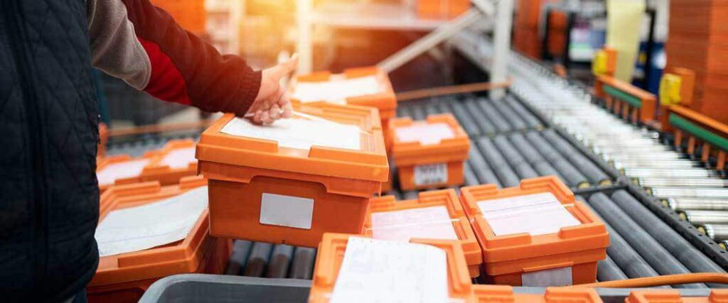 cold chain vaccine transportation in special containers rolling down assembly line