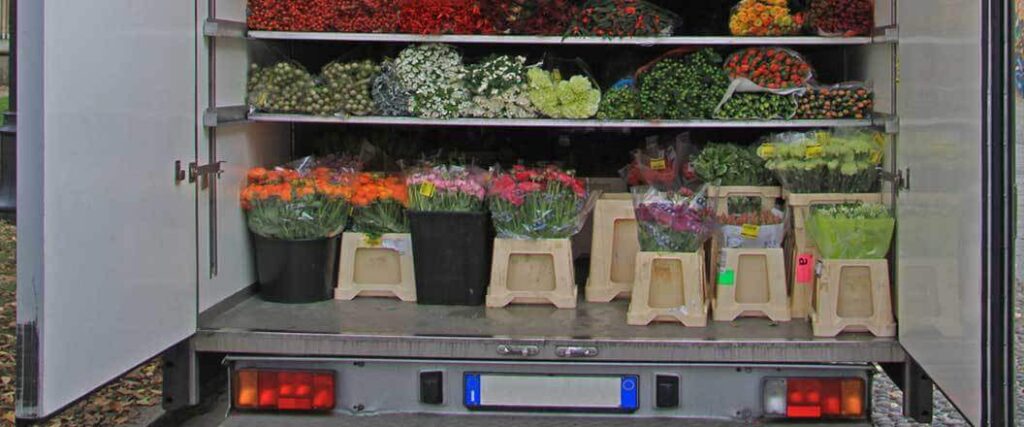 Bouquets of flowers in the back of a reefer van that will transfer them through the flower cold chain logistics process